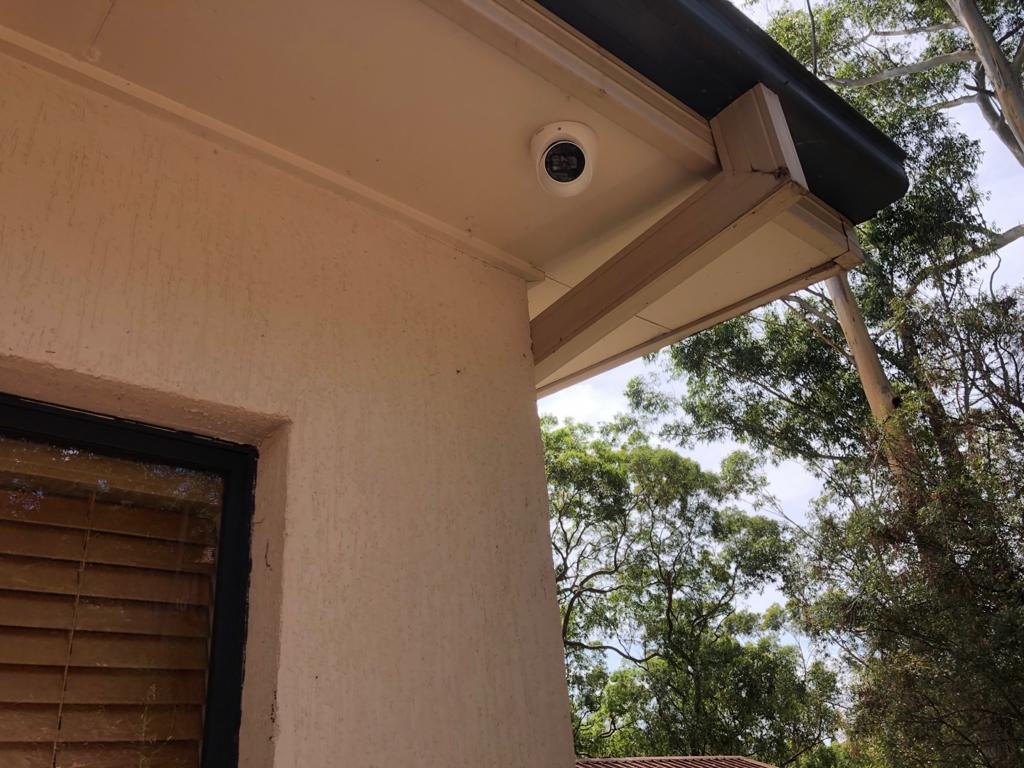 Discreet dome camera beneath a residential eave — Serious Security gallery